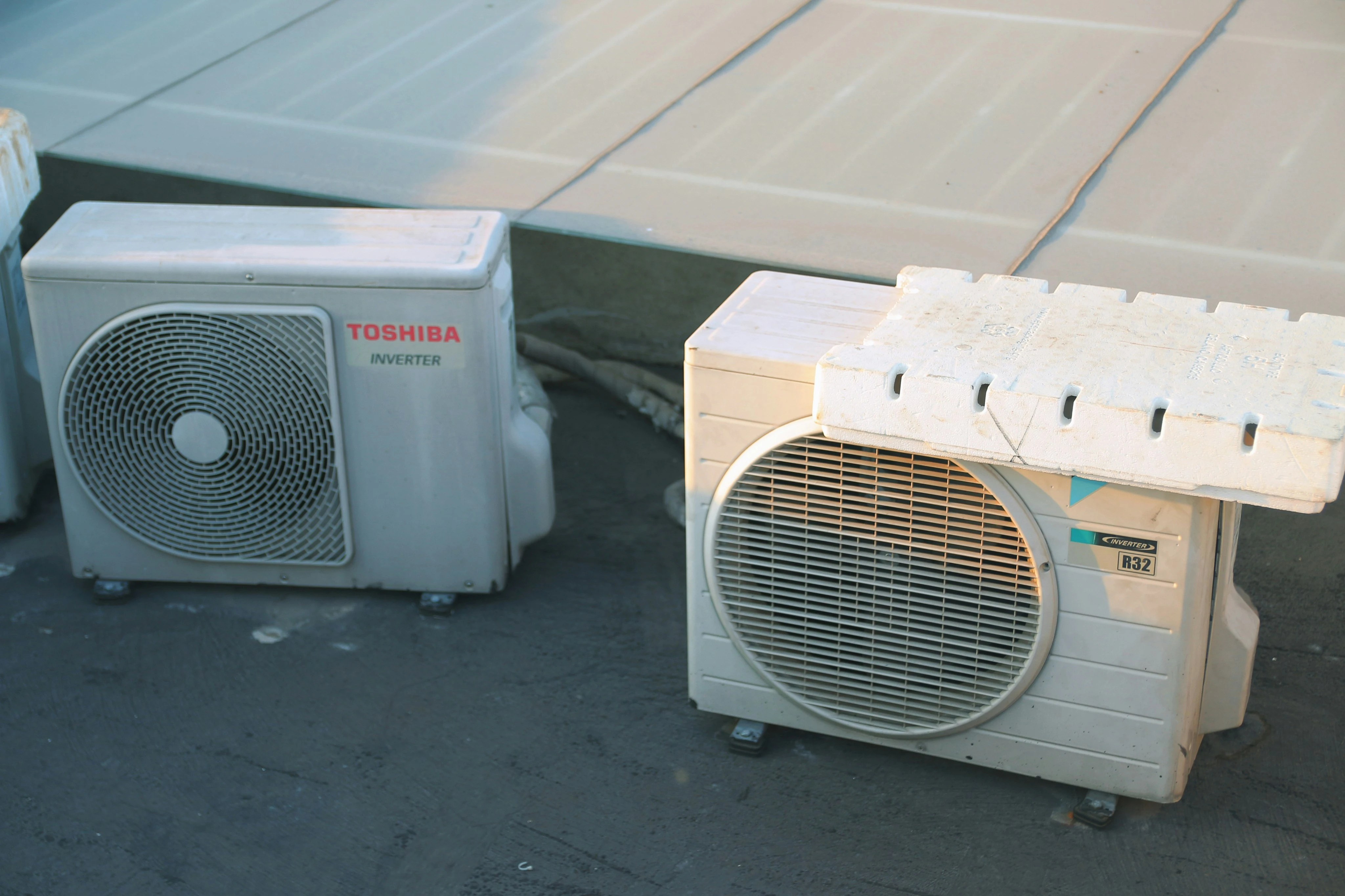 Technician from SixStar AirCond servicing an AC unit